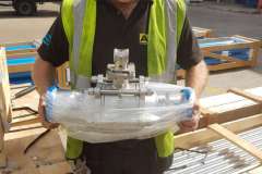Engineer-carrying-a-stainless-steel-ball-valve